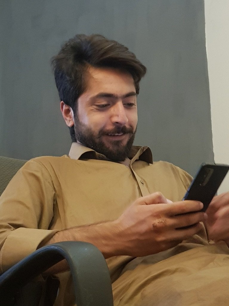 5D98F0BE-EE2F-4F48-BD6E-CB4B67944384_1_105_c Satisfied customer reviewing HP Pavilion laptop at Tech Town Swat, Mingora